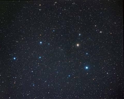 Starry night sky with scattered bright stars.